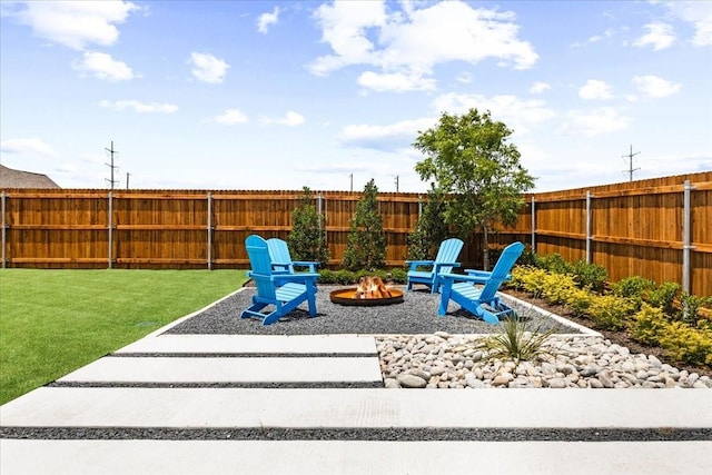 4342 Hudson St, Fate, TX 75087 - fenced backyard featuring an outdoor fire pit and a patio area
