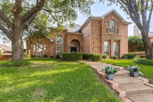 2420 Norwich Dr, Carrollton, TX 75006 - traditional home with brick siding and a front yard