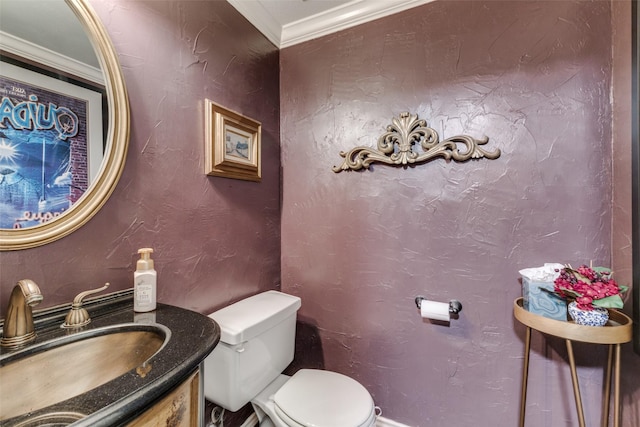 2420 Norwich Dr, Carrollton, TX 75006 - half bathroom with toilet, ornamental molding, and vanity