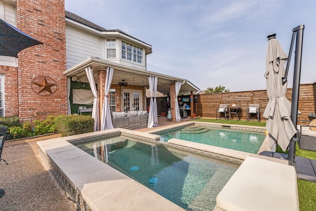 2420 Norwich Dr, Carrollton, TX 75006 - view of pool featuring a fenced backyard, a pool with connected hot tub, an outdoor living space, and a patio area