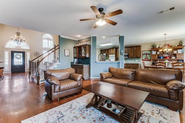 2420 Norwich Dr, Carrollton, TX 75006 - living room featuring a chandelier, stairs, bar area, hardwood / wood-style floors, and ceiling fan