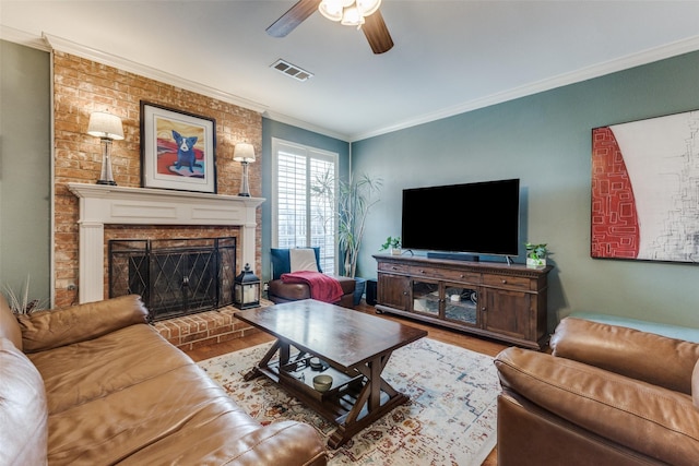2420 Norwich Dr, Carrollton, TX 75006 - living area with wood finished floors, ceiling fan, a brick fireplace, and ornamental molding