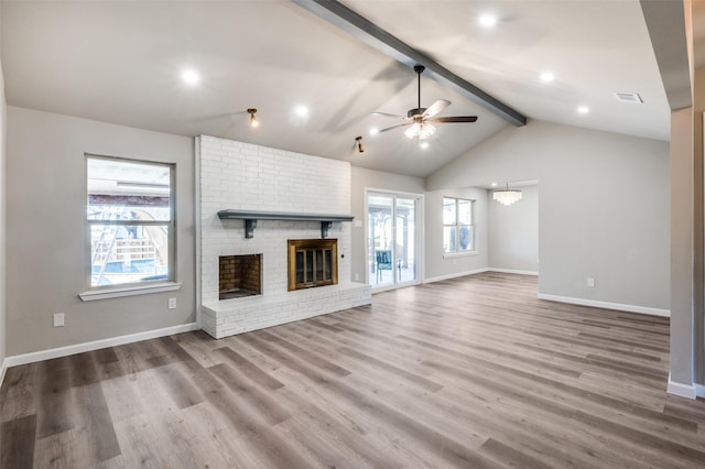 7013 Post Oak Dr, North Richland Hills, TX 76182 - unfurnished living room featuring a ceiling fan, a brick fireplace, wood finished floors, a chandelier, and recessed lighting
