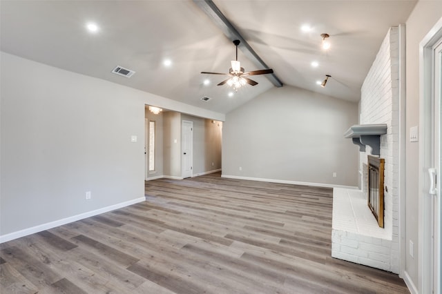 7013 Post Oak Dr, North Richland Hills, TX 76182 - unfurnished living room featuring ceiling fan, wood finished floors, a brick fireplace, and recessed lighting
