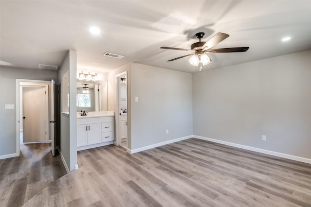 7013 Post Oak Dr, North Richland Hills, TX 76182 - unfurnished bedroom featuring light wood-type flooring, connected bathroom, recessed lighting, and ceiling fan