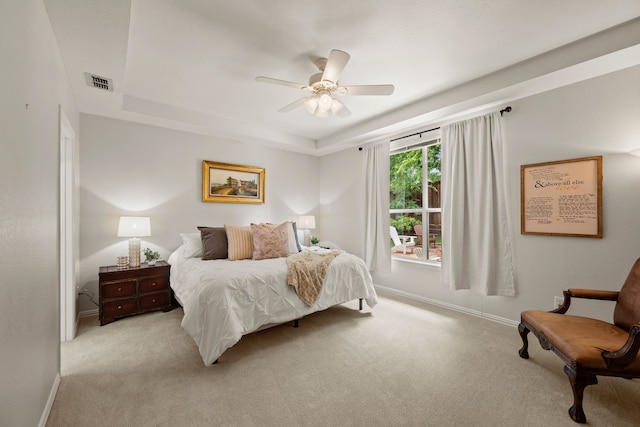 521 Austin Oaks Dr, Grapevine, TX 76051 - bedroom with light carpet, a tray ceiling, baseboards, and a ceiling fan