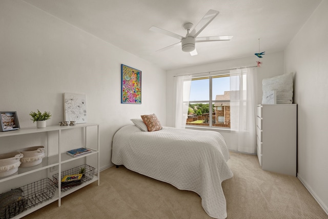 521 Austin Oaks Dr, Grapevine, TX 76051 - bedroom with light colored carpet, ceiling fan, and baseboards