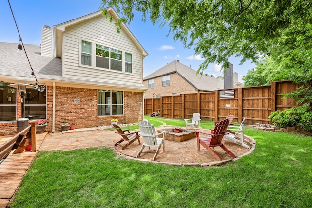 521 Austin Oaks Dr, Grapevine, TX 76051 - back of property with a patio area, brick siding, a fire pit, and roof with shingles