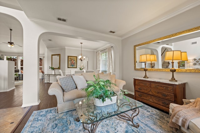 521 Austin Oaks Dr, Grapevine, TX 76051 - living room featuring ornamental molding, wood finished floors, baseboards, arched walkways, and a ceiling fan