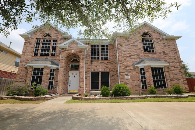 1104 Ruby St, Plano, TX 75094 - traditional home with fence and brick siding