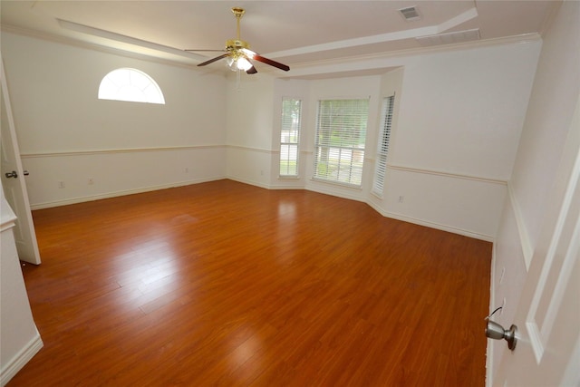 1104 Ruby St, Plano, TX 75094 - unfurnished room with wood finished floors, a raised ceiling, plenty of natural light, and ornamental molding
