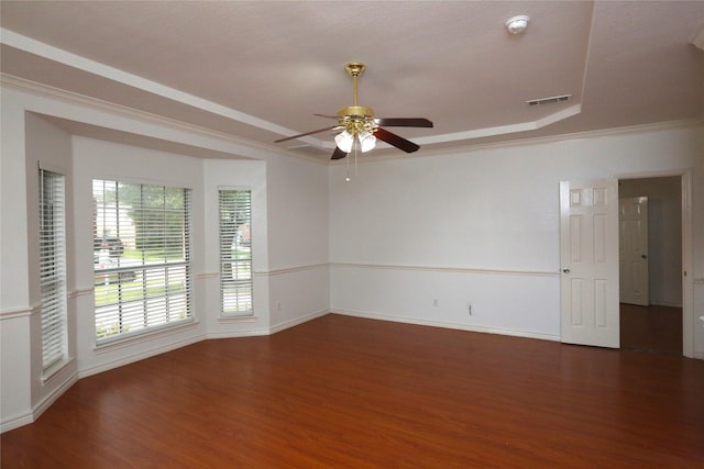 1104 Ruby St, Plano, TX 75094 - unfurnished room with wood finished floors, a raised ceiling, ceiling fan, baseboards, and crown molding