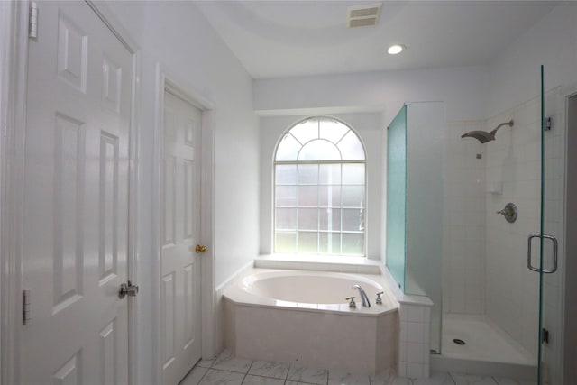 1104 Ruby St, Plano, TX 75094 - full bath featuring a stall shower, a garden tub, and marble look tiles