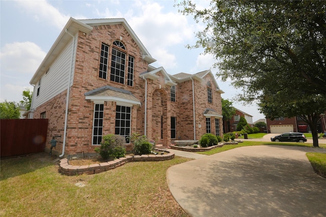 1104 Ruby St, Plano, TX 75094 - traditional-style home featuring brick siding and driveway