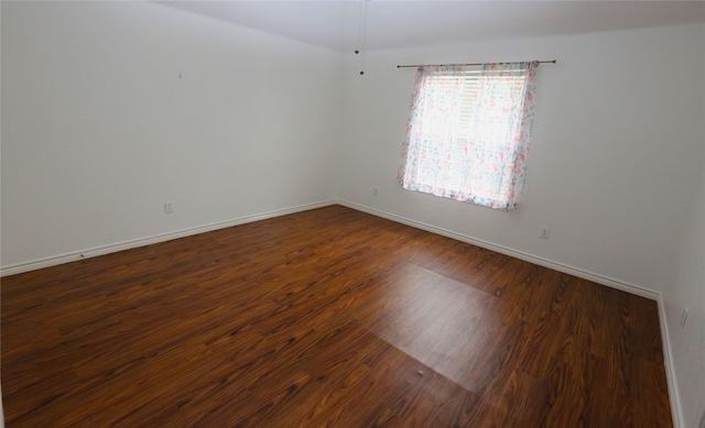 1104 Ruby St, Plano, TX 75094 - spare room with dark wood-style floors and baseboards