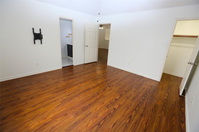 1104 Ruby St, Plano, TX 75094 - unfurnished bedroom featuring a spacious closet, wood finished floors, a closet, and baseboards