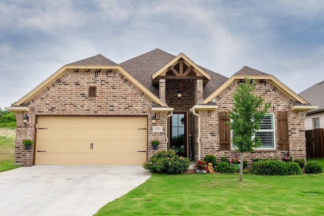 1232 Big Sky Dr, Weatherford, TX 76086 - french provincial home featuring brick siding, an attached garage, concrete driveway, and a shingled roof