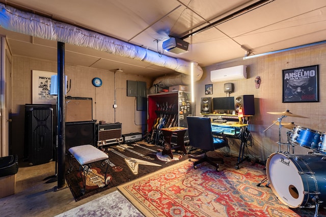 home office featuring a wall mounted air conditioner, concrete flooring, and electric panel