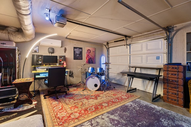 garage with a wall mounted air conditioner, a garage door opener, and an office area
