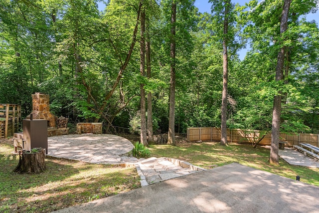 view of yard featuring a patio and fence