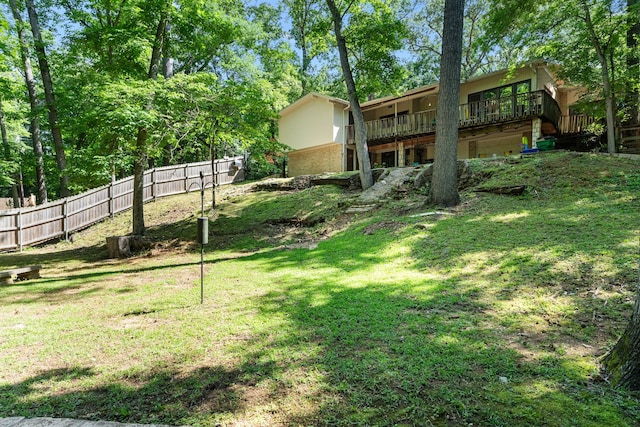 view of yard with a wooden deck