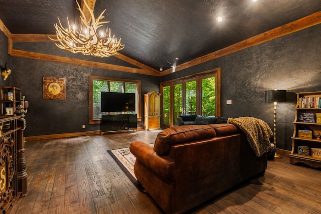 living area featuring lofted ceiling, a chandelier, wood-type flooring, a textured ceiling, and baseboards
