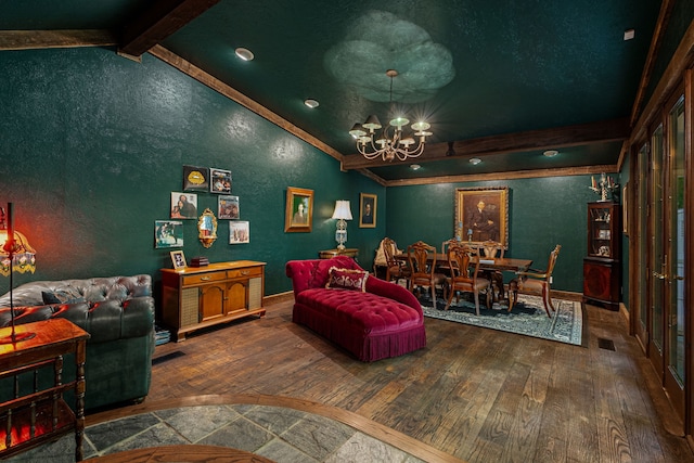 living room with a chandelier, wood-type flooring, crown molding, a textured wall, and baseboards