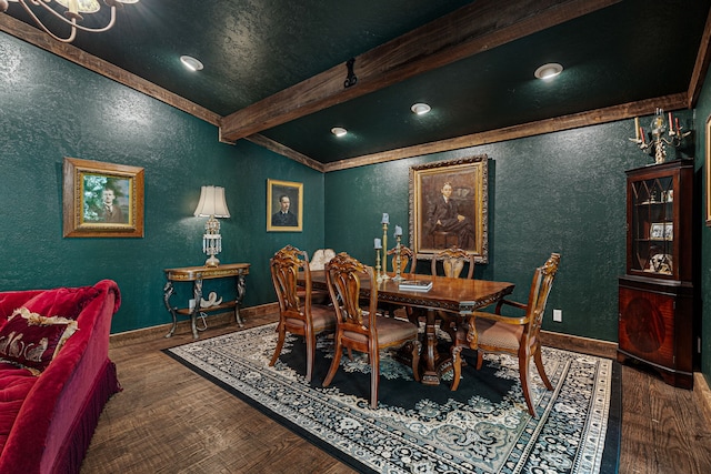 dining area featuring beam ceiling, a textured wall, baseboards, and wood finished floors
