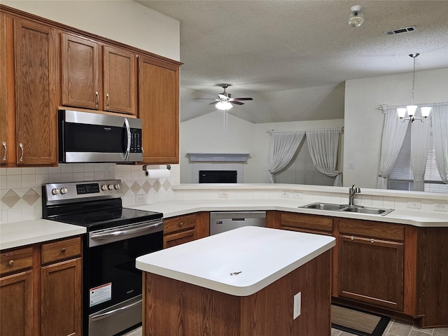 3406 Lake Highlands Dr, Rowlett, TX 75088 - kitchen featuring stainless steel appliances, a sink, ceiling fan, decorative backsplash, and lofted ceiling