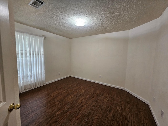 3406 Lake Highlands Dr, Rowlett, TX 75088 - spare room with wood finished floors, a textured ceiling, and baseboards