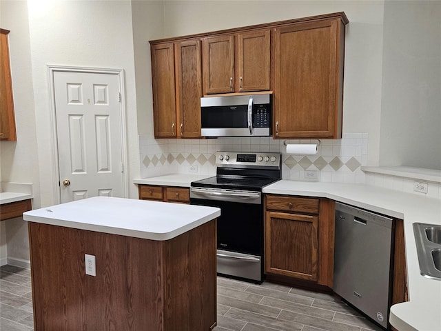 3406 Lake Highlands Dr, Rowlett, TX 75088 - kitchen featuring appliances with stainless steel finishes, tasteful backsplash, light countertops, wood tiled floors, and a sink