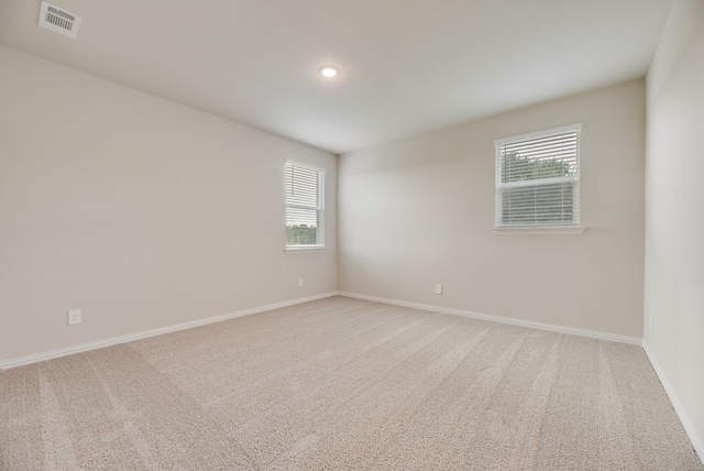 1301 Hickory Ct, Weatherford, TX 76086 - unfurnished room featuring light carpet, plenty of natural light, baseboards, and recessed lighting