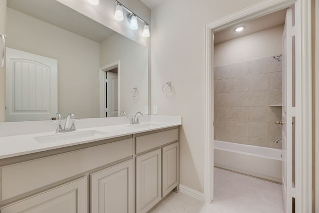 1301 Hickory Ct, Weatherford, TX 76086 - full bath with double vanity, shower / washtub combination, baseboards, and tile patterned floors