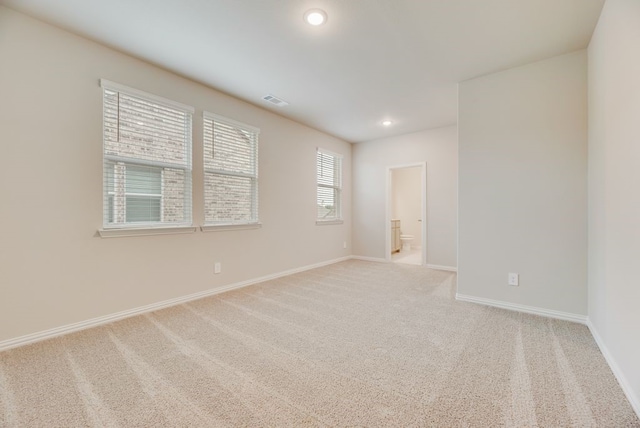 1301 Hickory Ct, Weatherford, TX 76086 - spare room with light carpet, baseboards, and recessed lighting