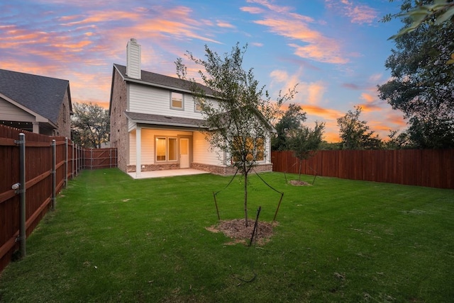 1301 Hickory Ct, Weatherford, TX 76086 - back of property at dusk with a patio area and a chimney