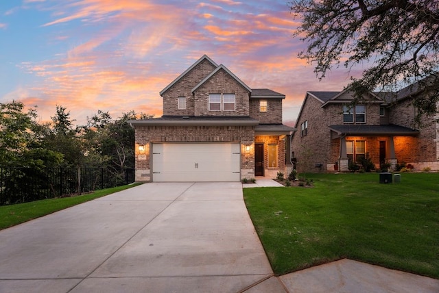 1301 Hickory Ct, Weatherford, TX 76086 - view of front facade with brick siding, driveway, a front yard, and an attached garage