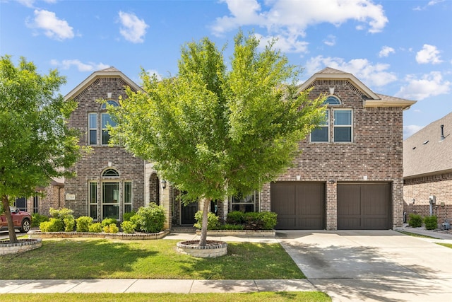 2314 Bob Sandlin Ln, Wylie, TX 75098 - traditional-style house featuring brick siding, a garage, a front yard, and concrete driveway