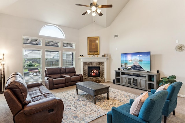 2314 Bob Sandlin Ln, Wylie, TX 75098 - living room featuring light carpet, a ceiling fan, high vaulted ceiling, a fireplace, and baseboards