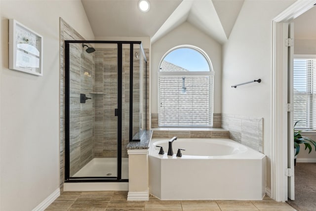 2314 Bob Sandlin Ln, Wylie, TX 75098 - full bath with vaulted ceiling, a stall shower, a garden tub, and baseboards