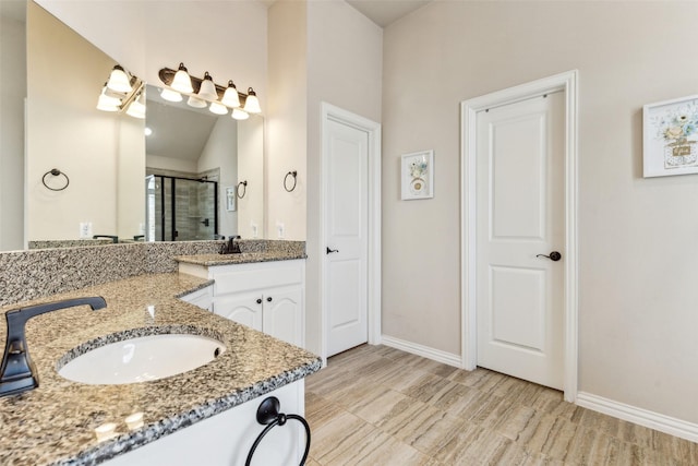 2314 Bob Sandlin Ln, Wylie, TX 75098 - full bathroom with a shower stall, two vanities, and baseboards