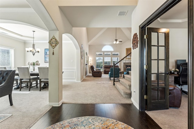 2314 Bob Sandlin Ln, Wylie, TX 75098 - entryway featuring dark wood-style flooring, stairs, arched walkways, a ceiling fan, and a chandelier