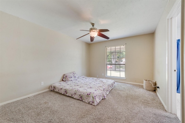 4914 Stagecoach Ln, Garland, TX 75043 - carpeted bedroom featuring baseboards and a ceiling fan