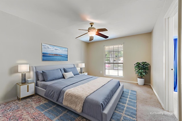 4914 Stagecoach Ln, Garland, TX 75043 - carpeted bedroom featuring baseboards and a ceiling fan