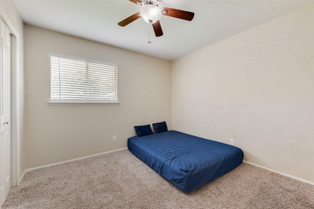 4914 Stagecoach Ln, Garland, TX 75043 - carpeted bedroom with baseboards and ceiling fan