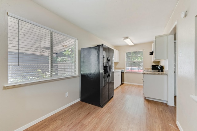 4914 Stagecoach Ln, Garland, TX 75043 - kitchen featuring black fridge, dishwasher, light wood-type flooring, white cabinets, and baseboards