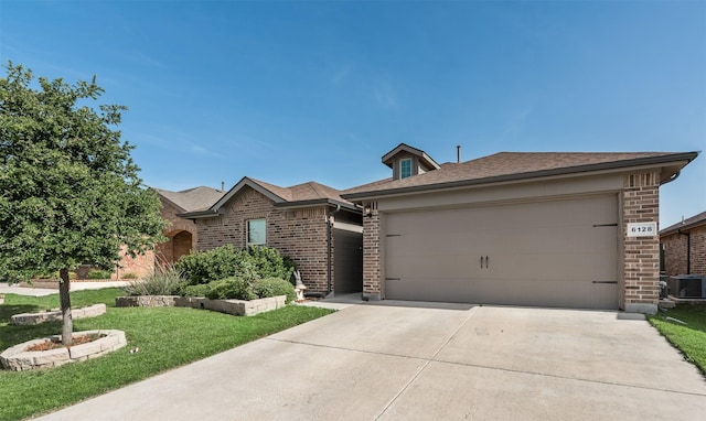 6128 Blacksmith Ave, Fort Worth, TX 76179 - view of front of house with brick siding, central AC unit, concrete driveway, and an attached garage