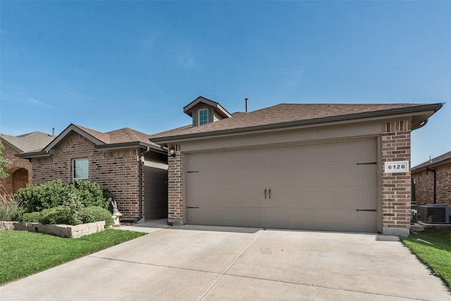 6128 Blacksmith Ave, Fort Worth, TX 76179 - view of front of house with brick siding, concrete driveway, central AC unit, and a garage