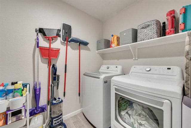 6128 Blacksmith Ave, Fort Worth, TX 76179 - laundry area featuring washing machine and clothes dryer and light wood-type flooring