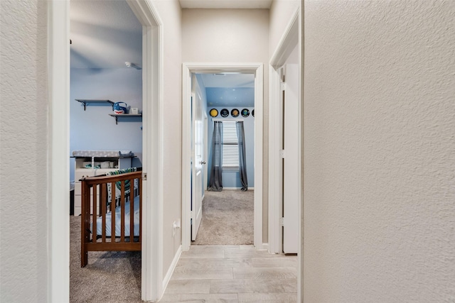 6128 Blacksmith Ave, Fort Worth, TX 76179 - hallway featuring carpet floors and a textured wall