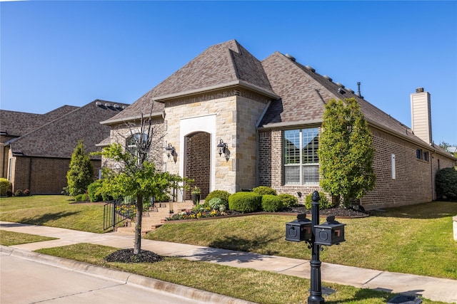 4207 Pearl Crescent Ln, Arlington, TX 76005 - french country style house with brick siding, a front lawn, a chimney, and a shingled roof